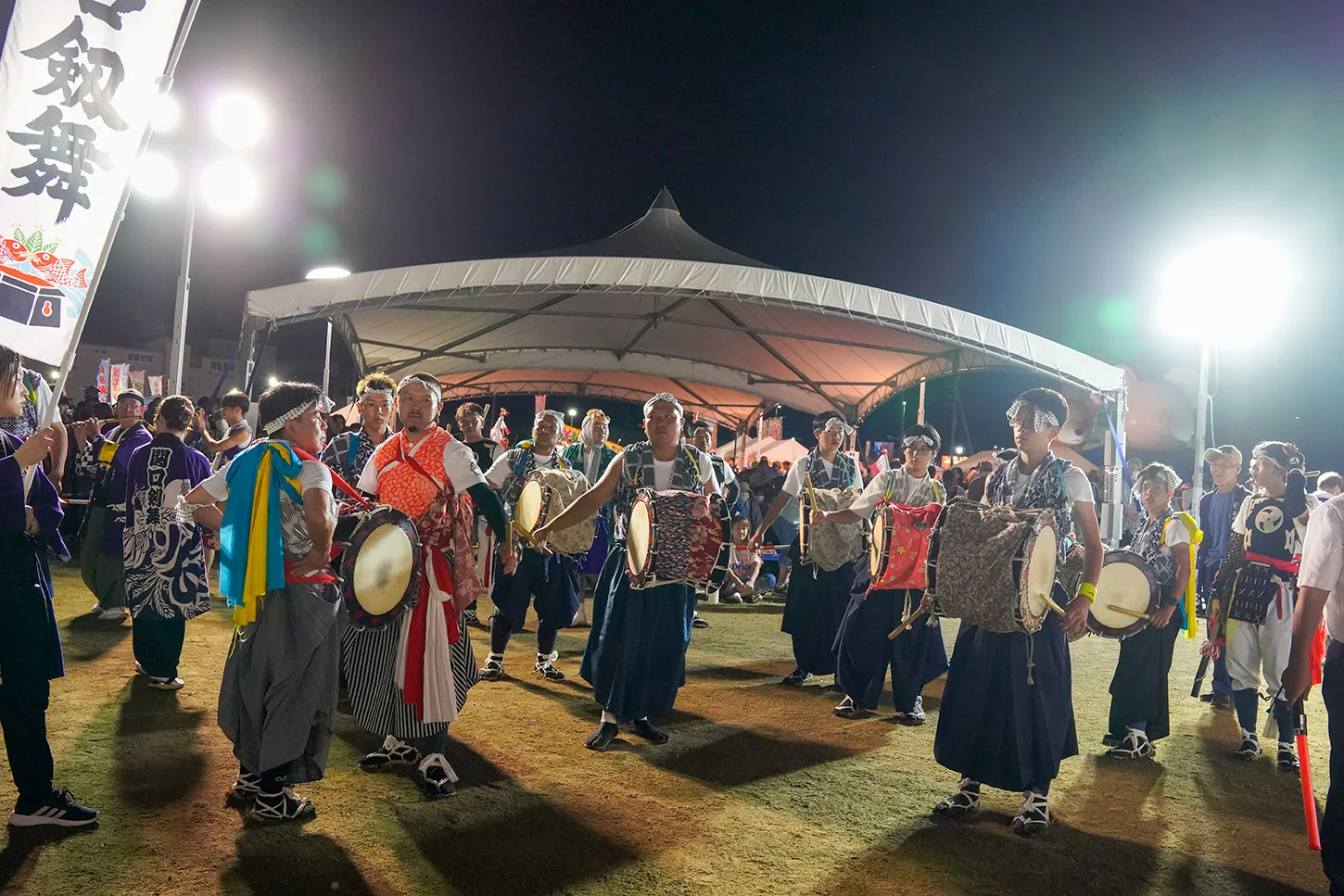 Sekiguchi Kenbai drummers performing in a circle at night during Yamada Matsuri