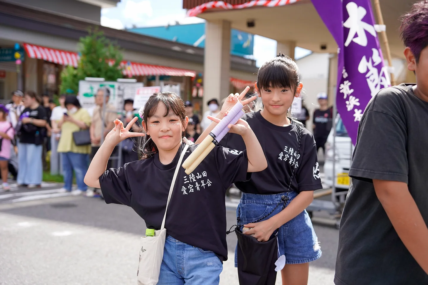 Children of the Atago youth association posing with drumsticks at Yamada Matsuri