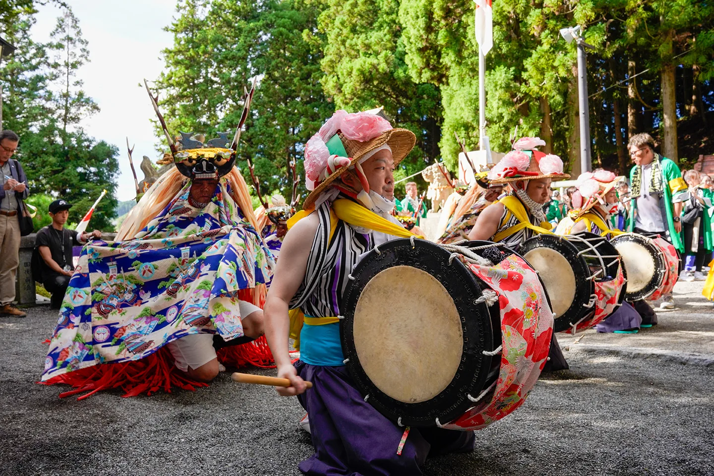 Drummers and deer-headed dancers performing a ritual dance at Yamada Matsuri